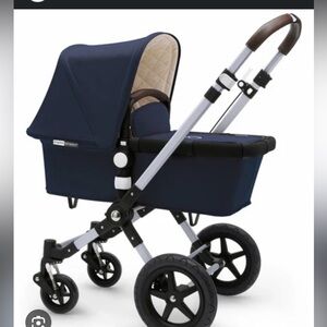 Bugaboo stroller with both parts and with rain cover.